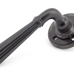 FROM THE ANVILĀ® Aged Bronze Hinton Lever on Rose Set